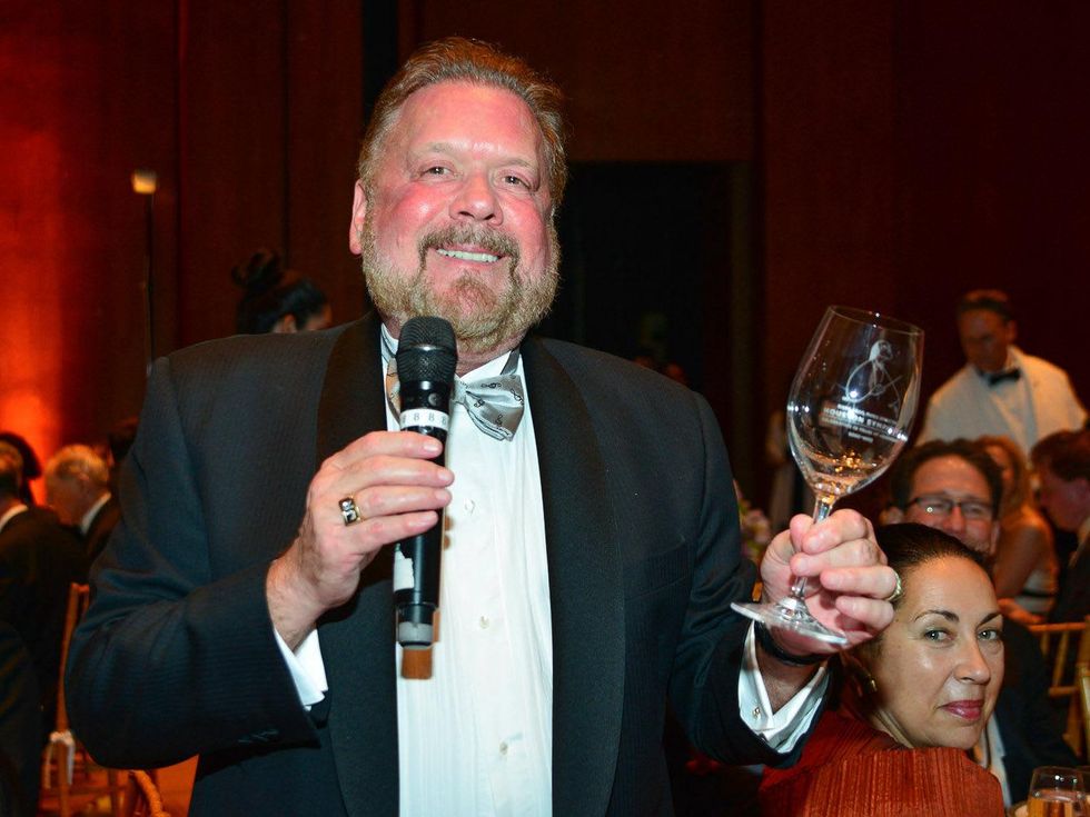 Houston Maestro's Dinner May 2013 John Rydman toasts with the commemorative Riedel wine glass etched with Hans Graf's portrait