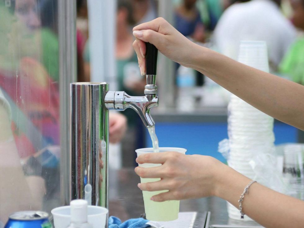 Houston Margarita Fest pouring a margarita from a spout October 2013