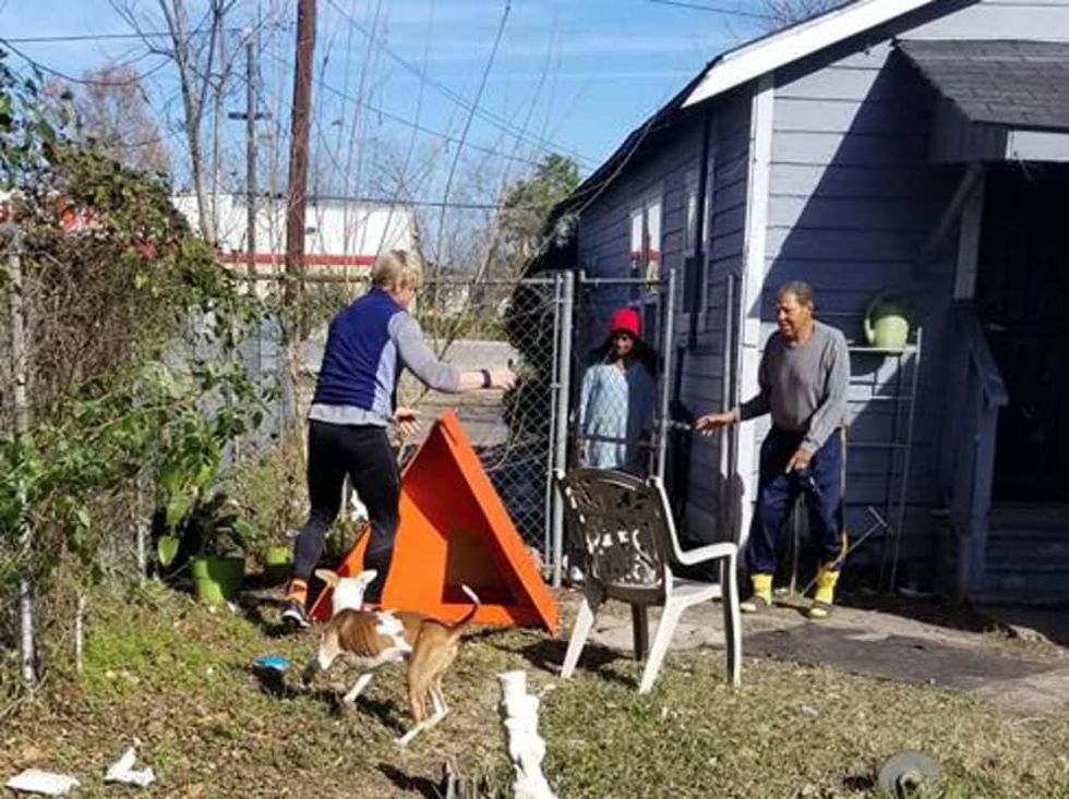 Houston Pet Set volunteers with happy dog and shelter