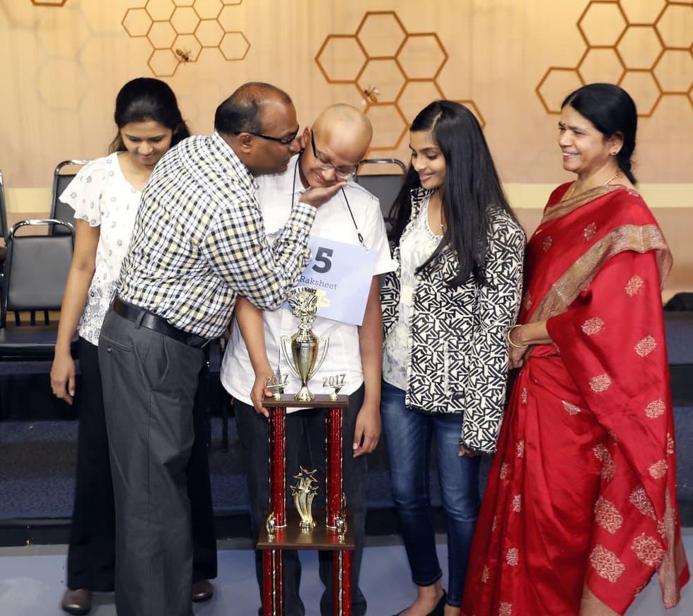 Houston Public Media Spelling Bee runnerup Raksheet Kota congratulated by his family