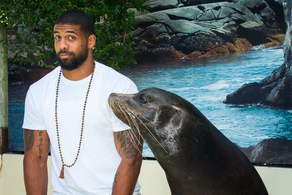 Houston Texan Arian Foster at Houston Zoo with seal