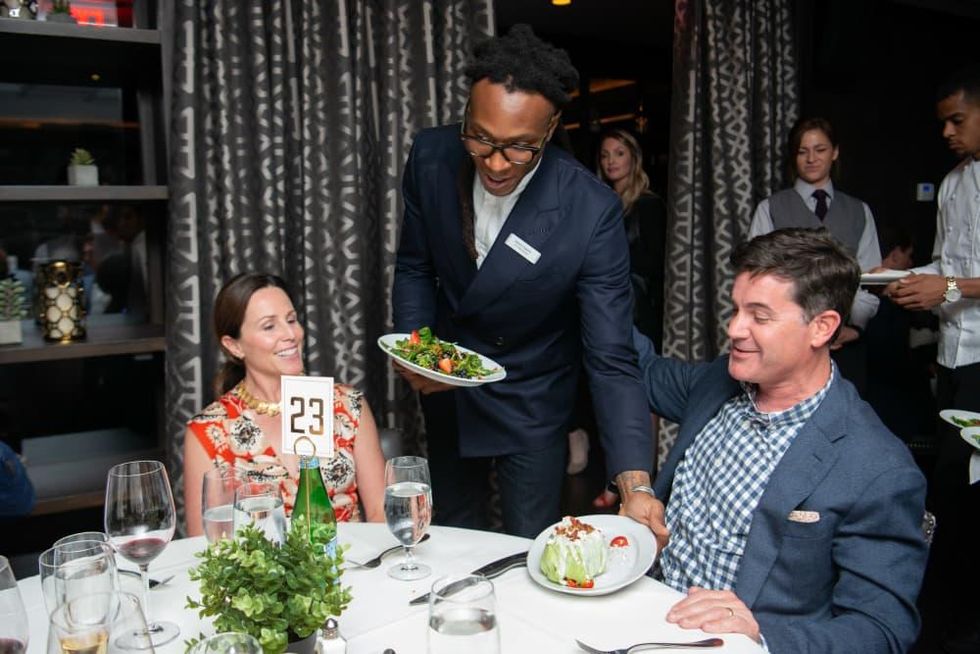 Houston Texans Champions for Youth Dinner DeAndre Hopkins serving