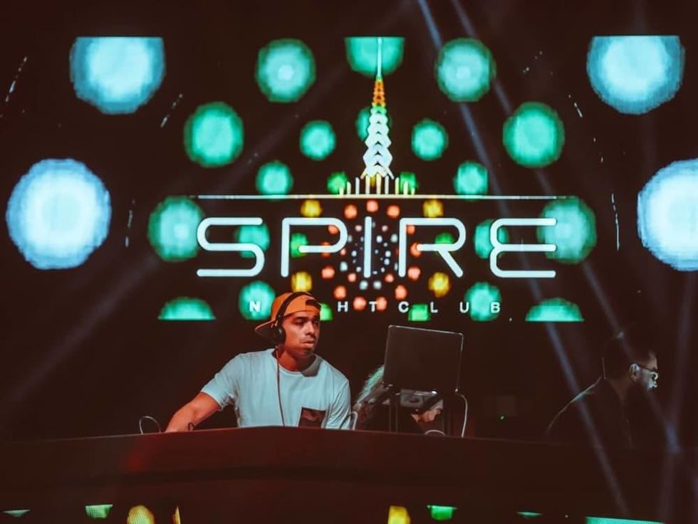 Houston, The Spire, Jan 2017, DJ in front of logo sign