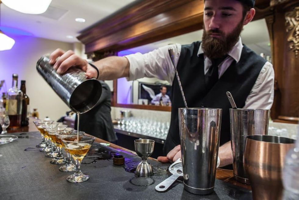 Houston Whiskey Festival bartender pouring