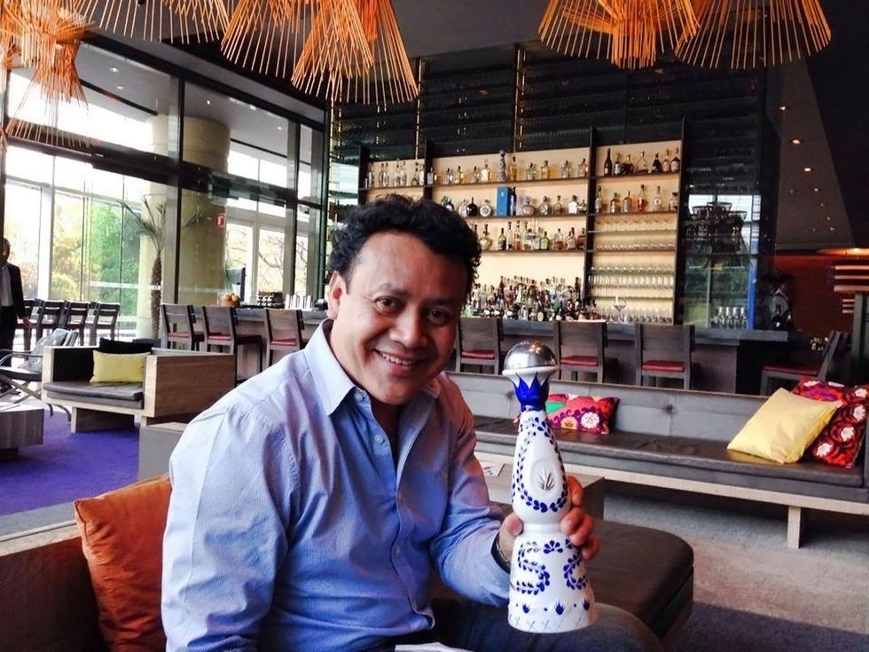 Hugo Ortega in Mexico at restaurant with tequila February 2014