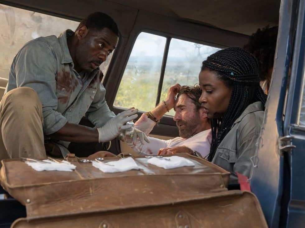 Idris Elba, Sharlto Copley, and Iyana Halley in Beast