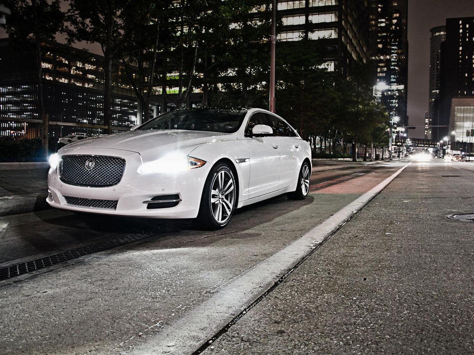 Putting the Jaguar XJ to the ultimate test: Houston's roads & sexy Trios