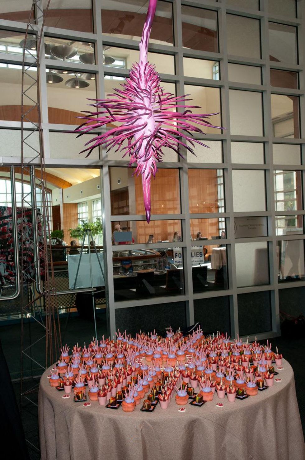 Installation view of Spin Drop Flower by Lee Littlefield, with Phoenicia\u2019s designed desserts at UH School of Art fundraiser