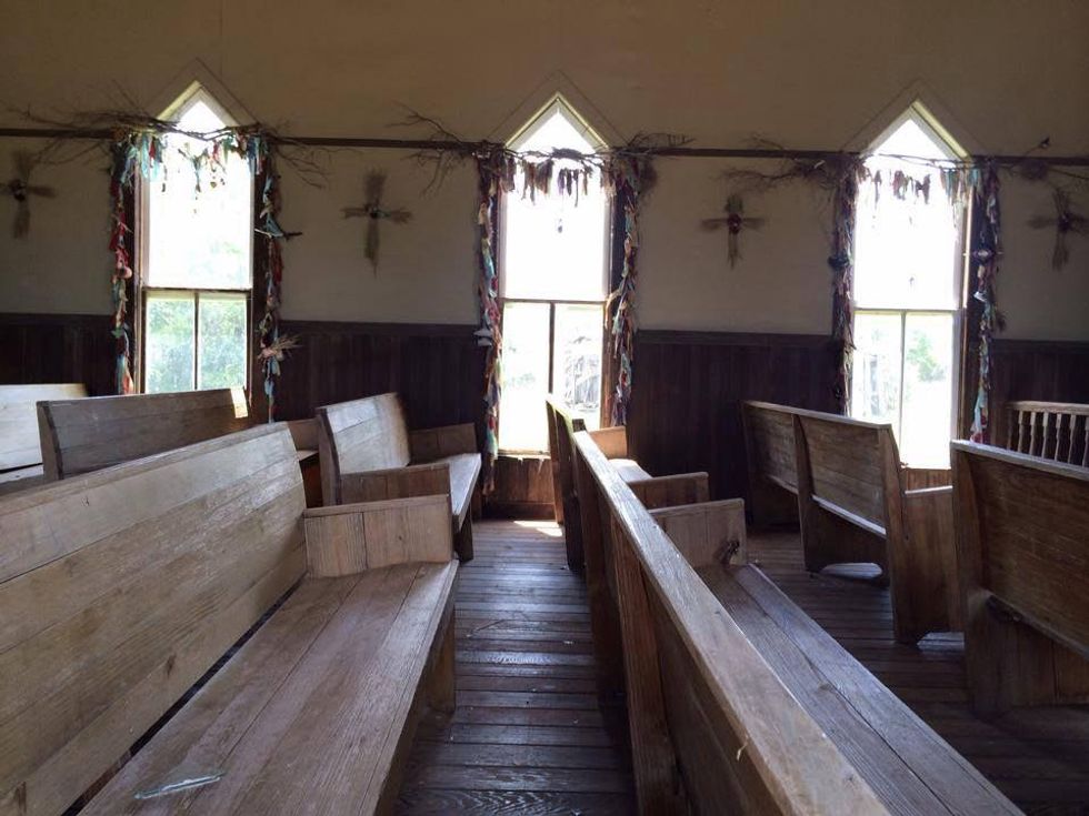 interior of church with pews in Luck TX on Willie Nelson's ranch after storm