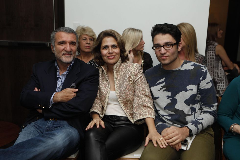 Iraj and Fariba Taghi, from left, with Amir Taghi at the David Peck runway show September 2014