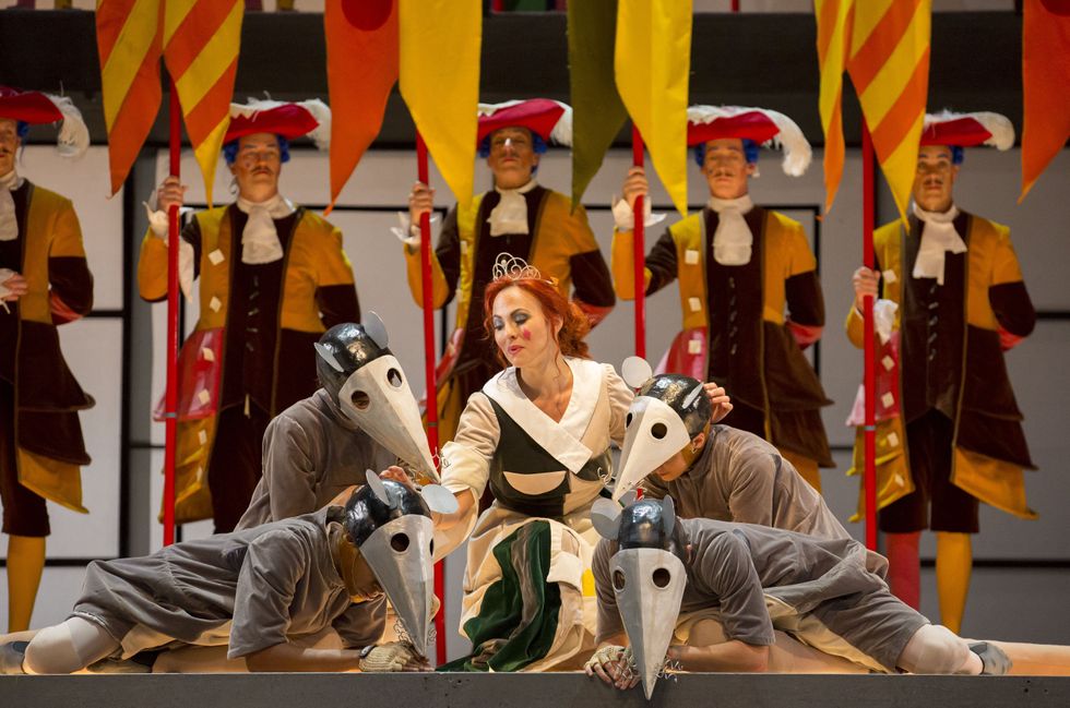 Isabel Leonard as Angelina, center, surrounded by costumed actors in pointy-nosed rat costumes, with royal guards in the background.