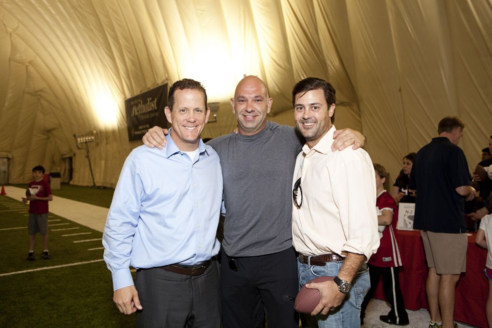 Jamey Rootes, from left, Rick Perez and Ernie Cockrell at The Society for Leading Medicine Houston Texans Family Field Day May 2014