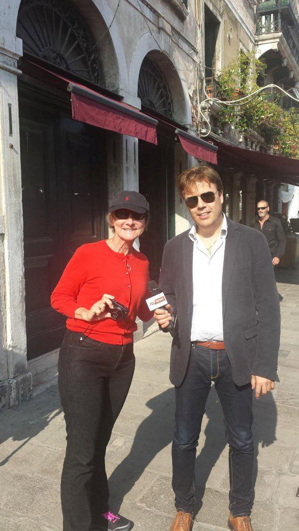 Jane Howze and Italian TV newscaster in Venice