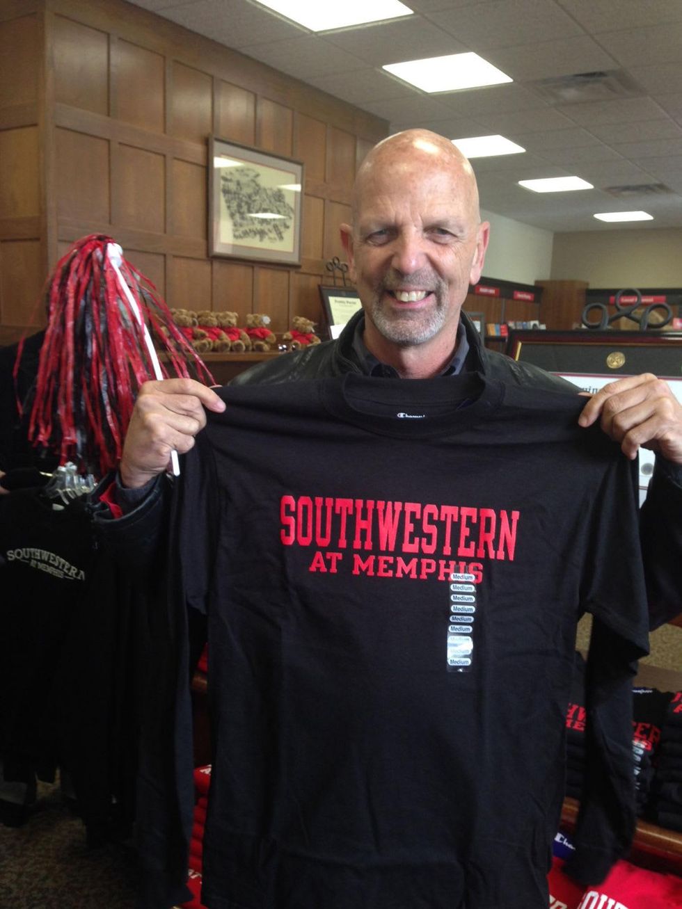 Jane Howze Homecoming October 2013 Clifford Pugh holding Southwestern at Memphis T-shirt