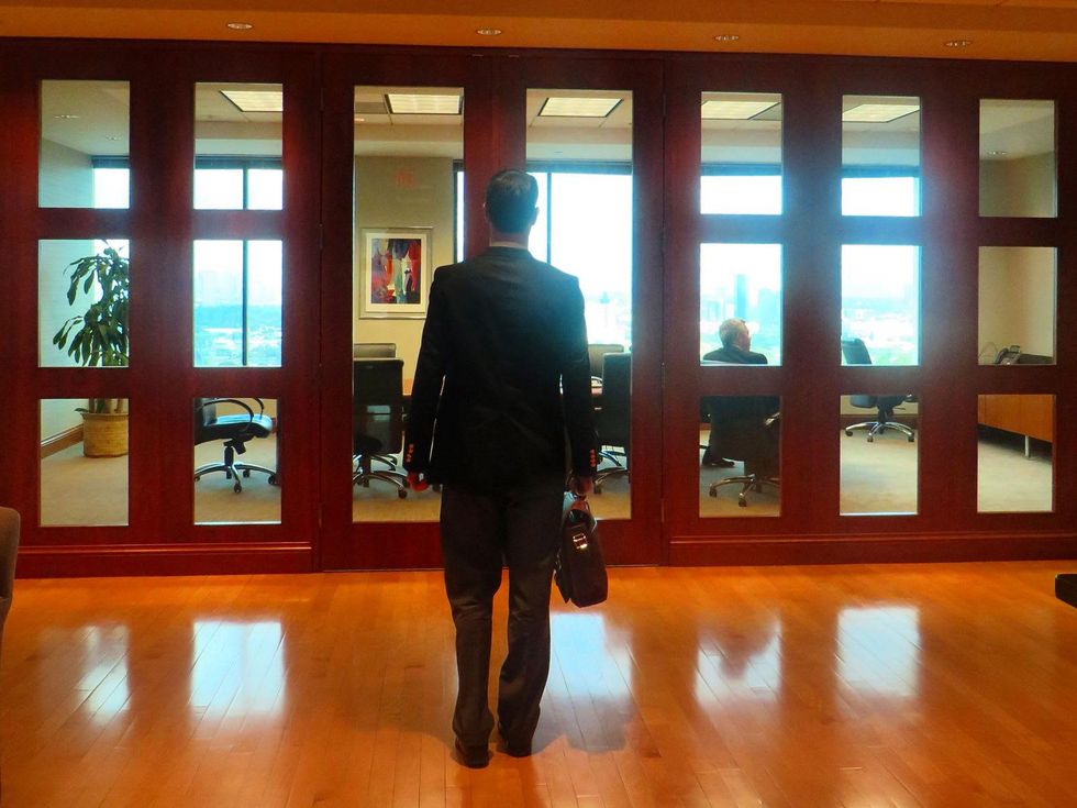 Jane Howze millenials in the workplace young man in suit in office