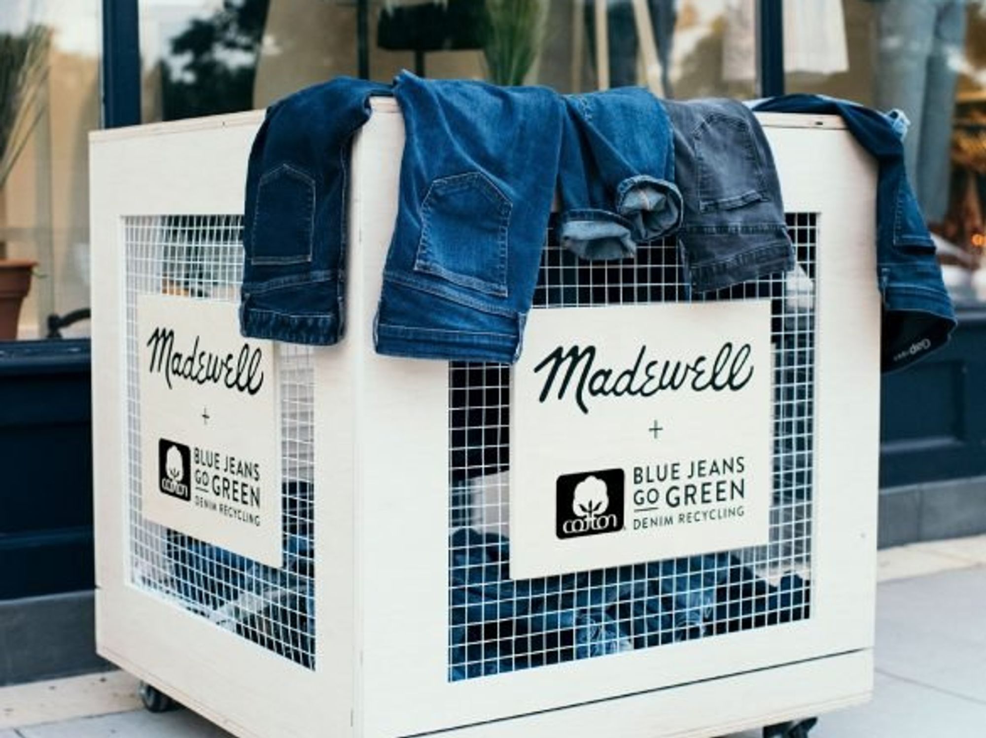 jeans in a recycle bin