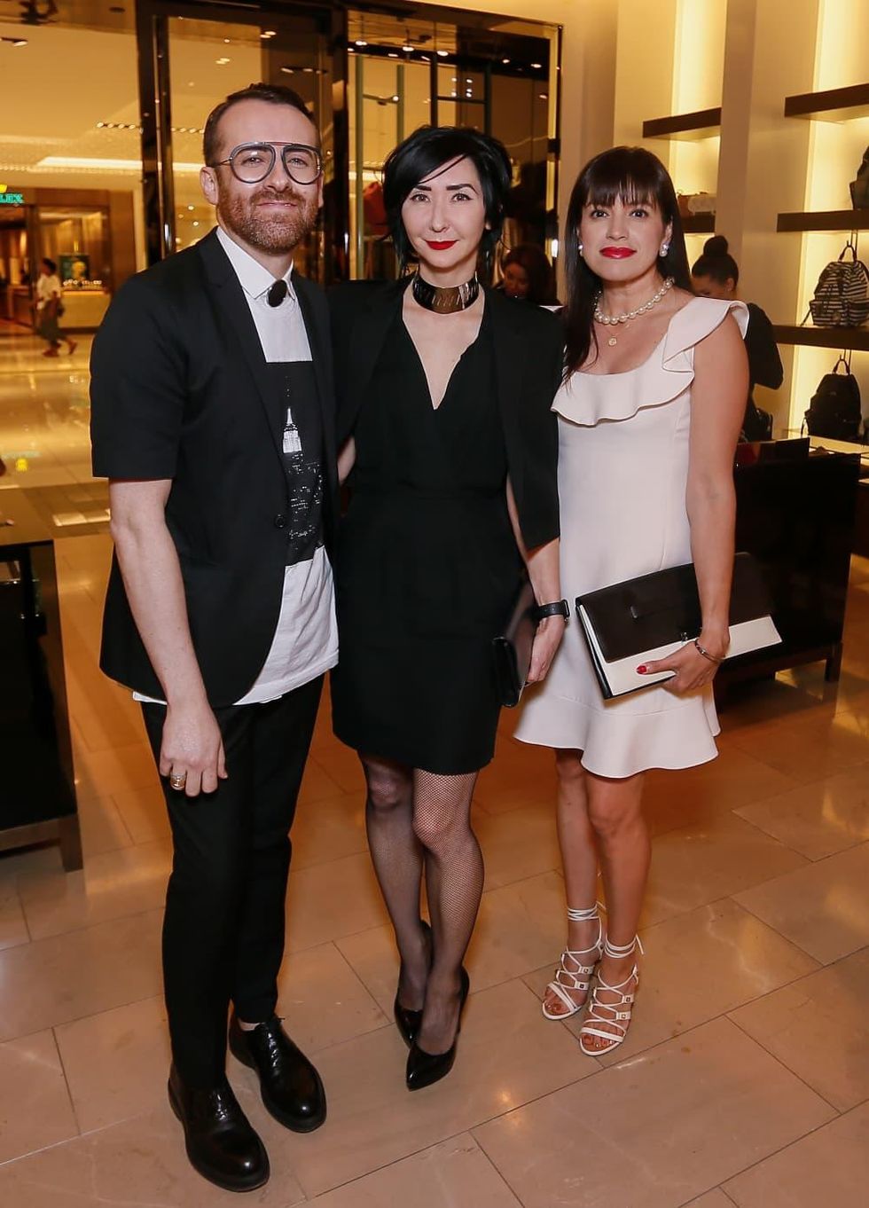 Jeremy Garcia, Carrie Brandsberg Dahl, Sandra Manela at Burberry Plum Sykes book signing