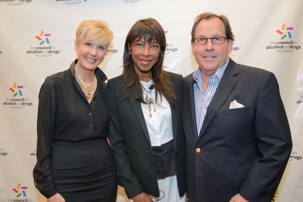Jerri Duddlesten Moore, from left, Natalie Cole and Jim Moore at the Council on Alcohol and Drugs luncheon May 2014