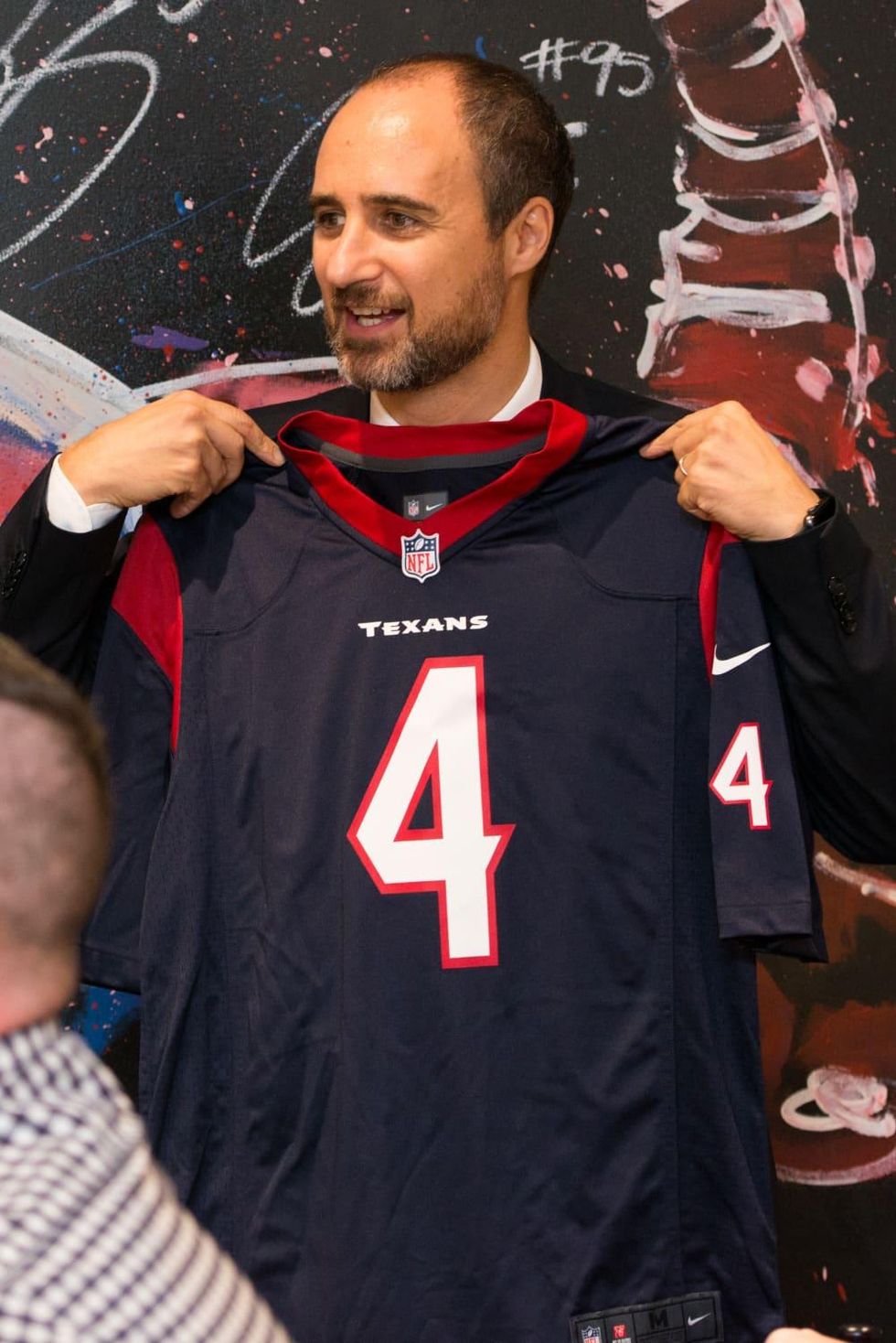 Jeweler Mattia Cielo and Texans jersey at IW Marks