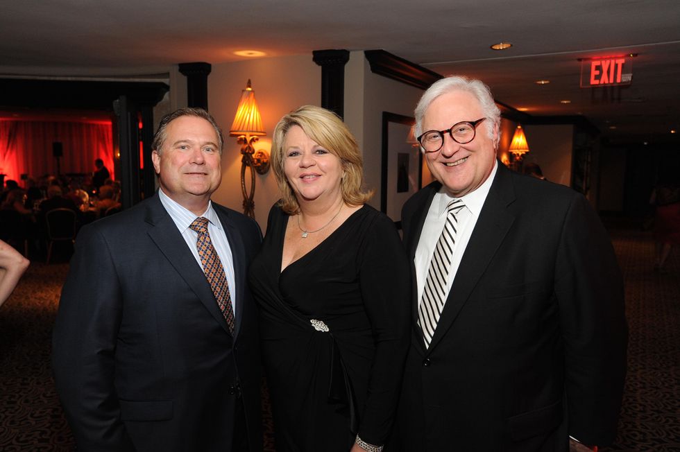 Jim Mills, from left, Brenda Stardig and Greg Ortale at the Houston Arts Alliance event with Rita Moreno May 2014