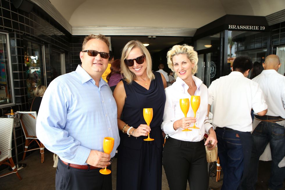 Joe and Nancy Math\u00e9, from left, with Paula Mott at Veuve Clicquot at Brasserie 19