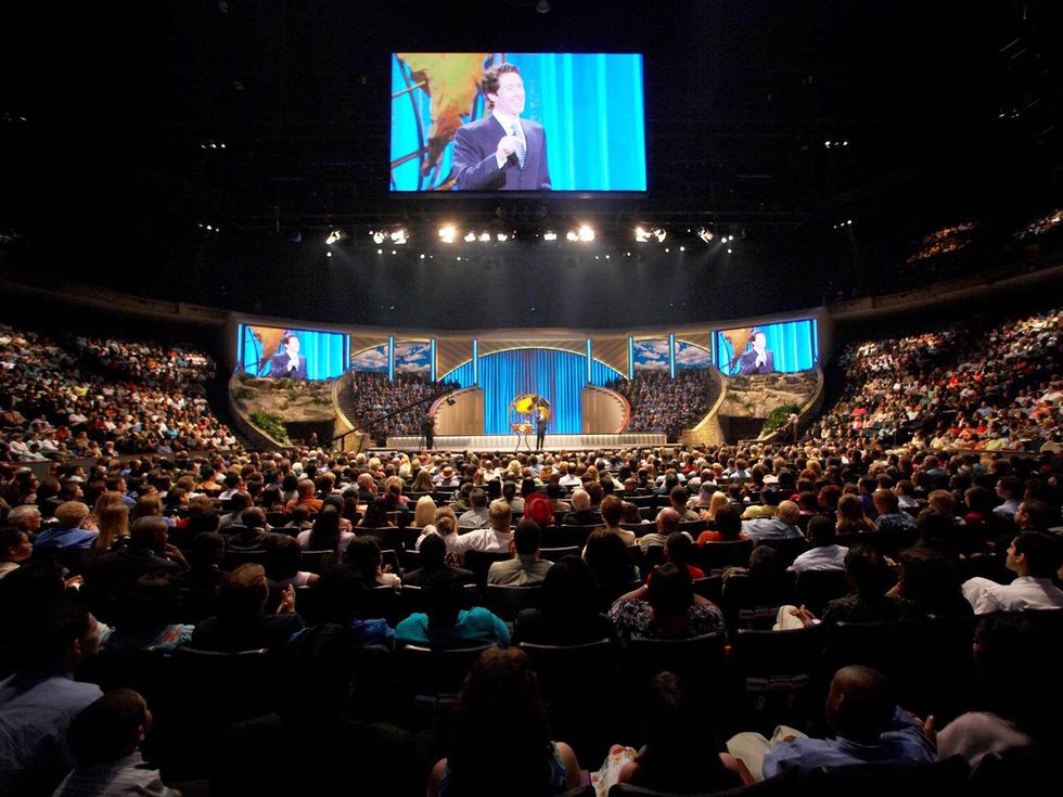 Joel Osteen preaching at Lakewood Church before huge crowd
