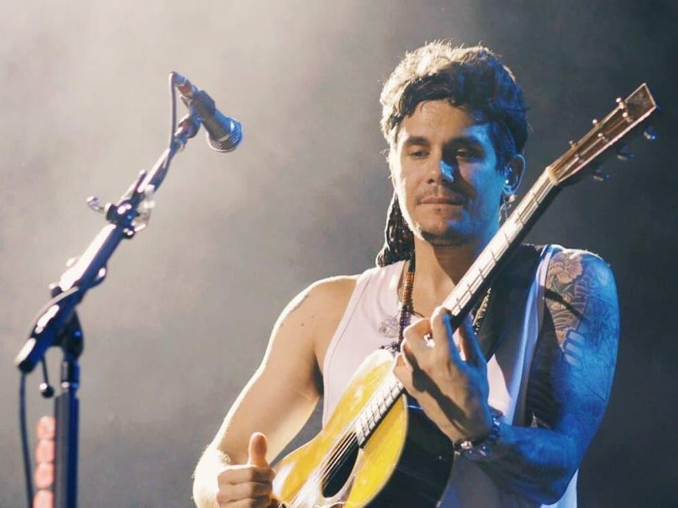 John Mayer in Kansas City in concert with guitar July 2013
