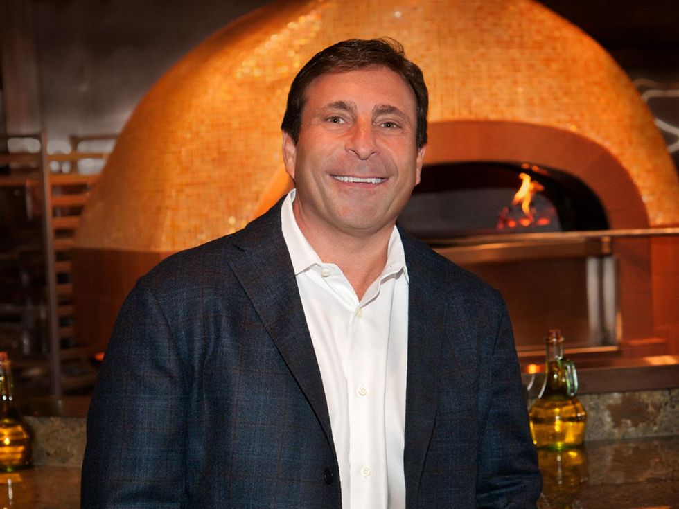 Johnny Carrabba head shot in front of fireplace