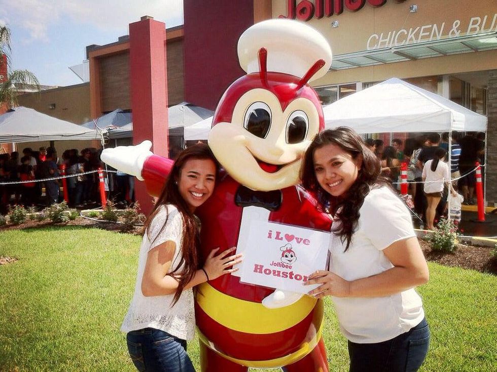 Jollibee Houston grand opening with mascot and smiling girls September 2013