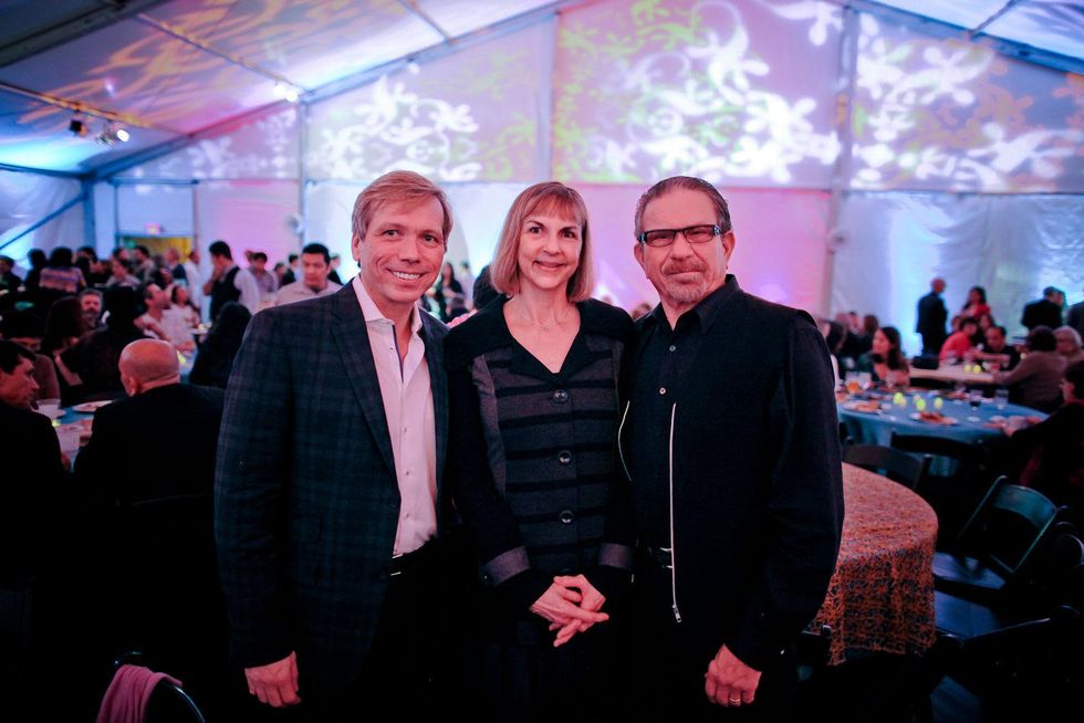 Jonathon Gluss, from left, Victoria and Marshal Lightman at the FotoFest opening party March 2014
