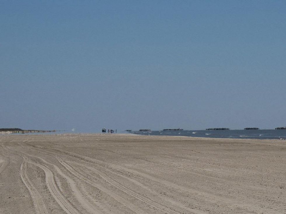 Katie Louisiana Revisited part 6 May 2013 Beach, berms and and workers further down at Grand Isle