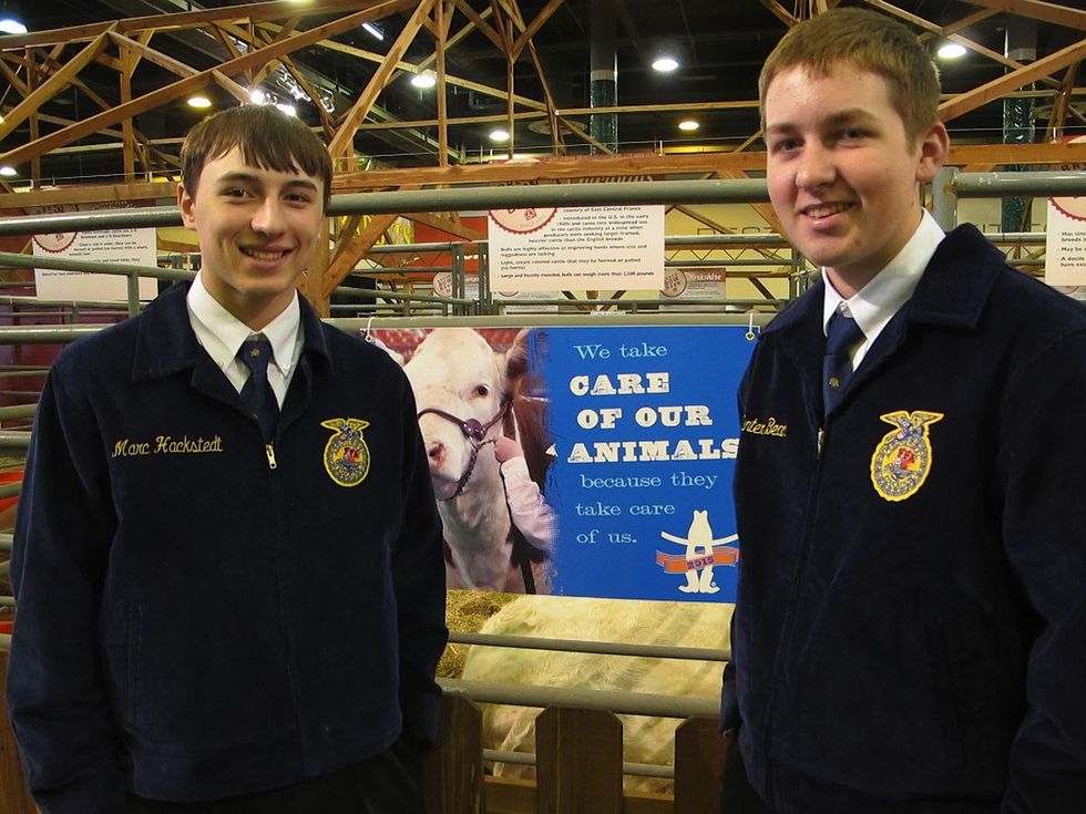 Katie Oxford Houston Rodeo FFA March 2015 Miles Hackstedt (although his jacket reads Marc), left, and Hunter Bean, Charolais in pen