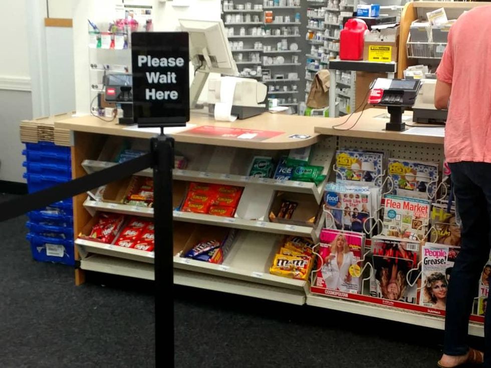 Ken Hoffman CVS sign please wait