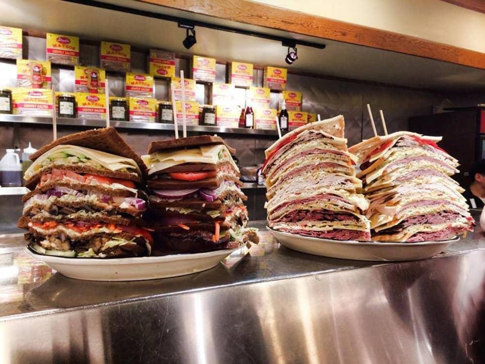 Kenny & Ziggy's giant deli sandwiches on counter