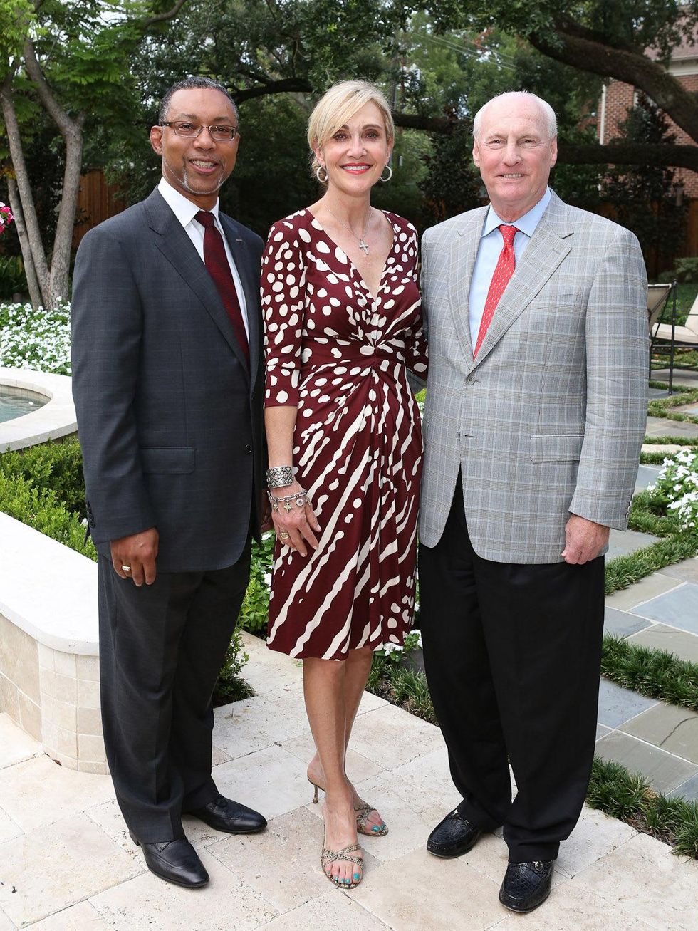 Kevin Lofton, left, with Jana and Scotty Arnoldy September 2013
