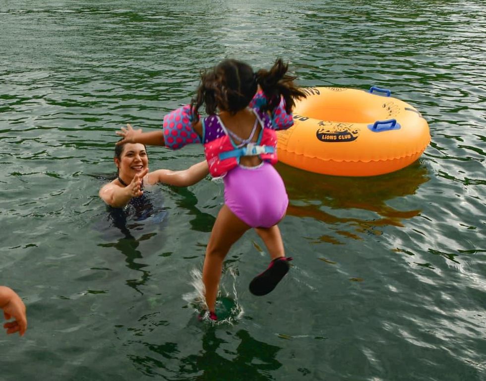 Kid jumping into the river