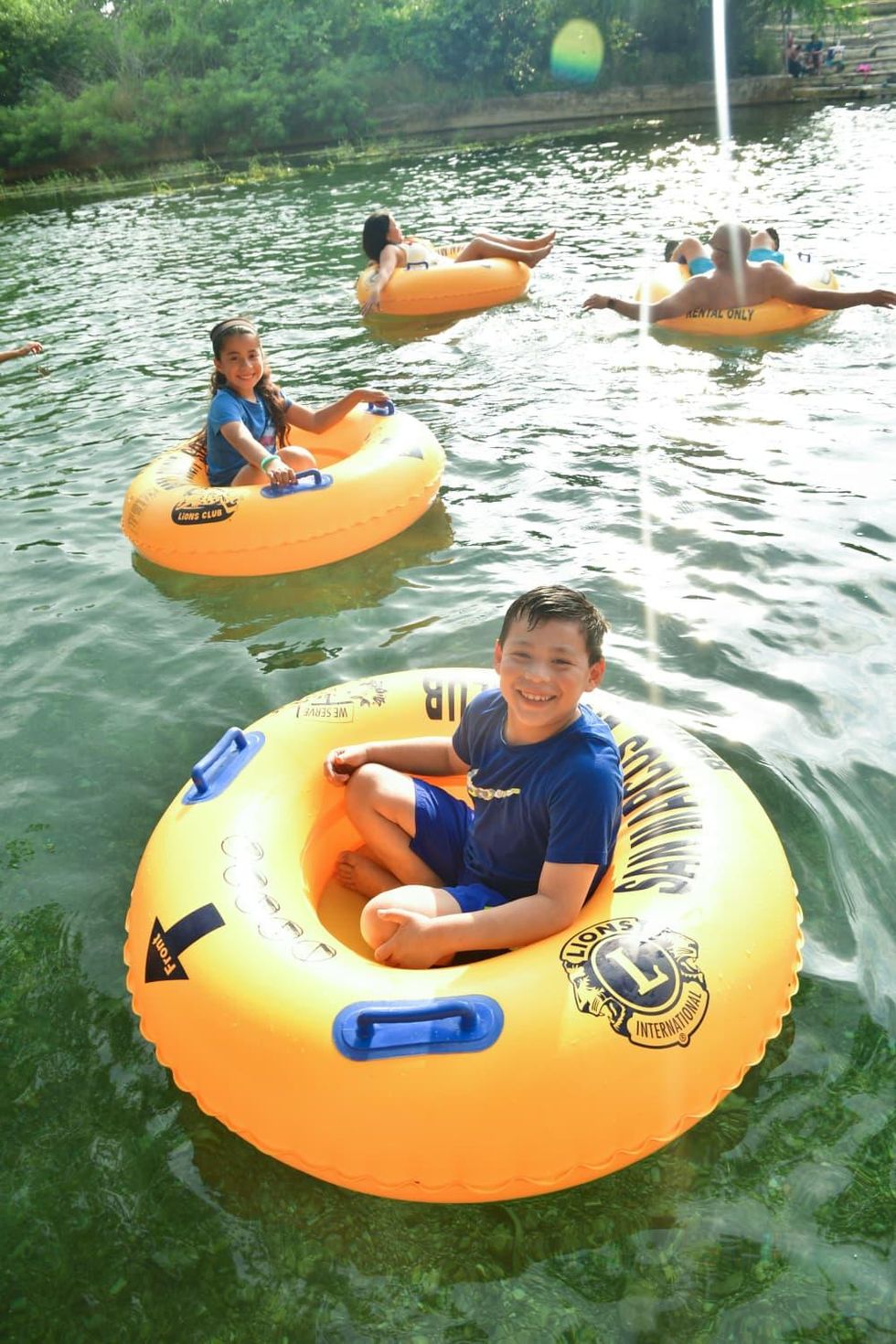 Kids in inner tubes on San Marcos River