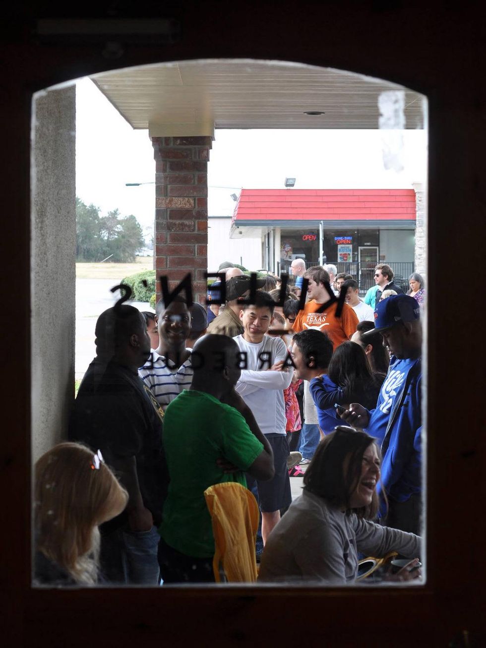 Killen's BBQ line outside door pre-opening February 2014