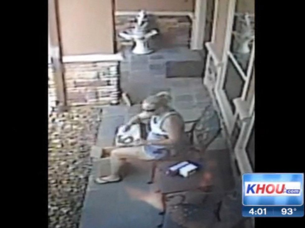 Kingwood thief woman trying on shoes June 2013 WITH BLACK RUN FLAT