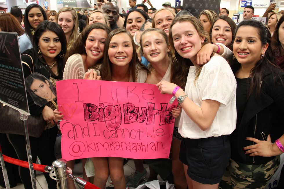 Kinkaid students with sign at Kardashian appearance at Sears Willowbrook Mall in Houston