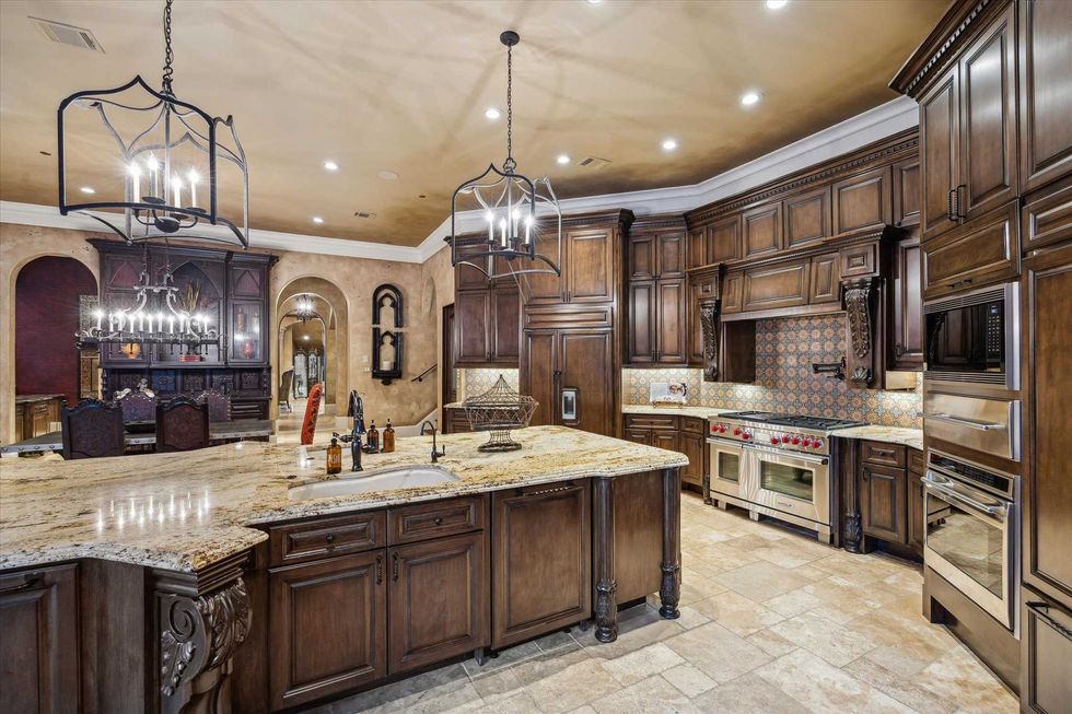 Kitchen of 11095 Memorial Drive with dark wood accents