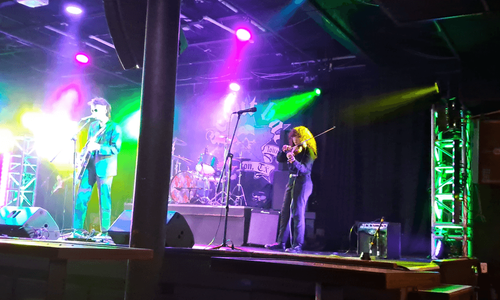 Kyla Rocha with violin on stage