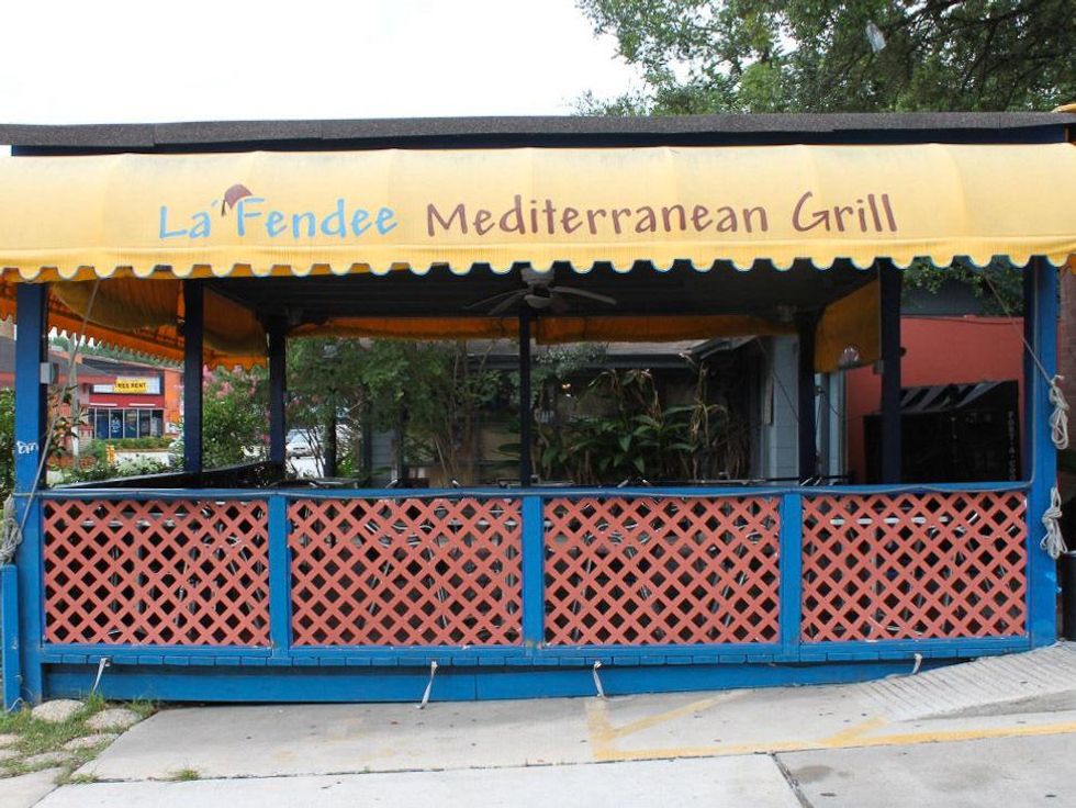 La Fendee patio exterior with sign on awning