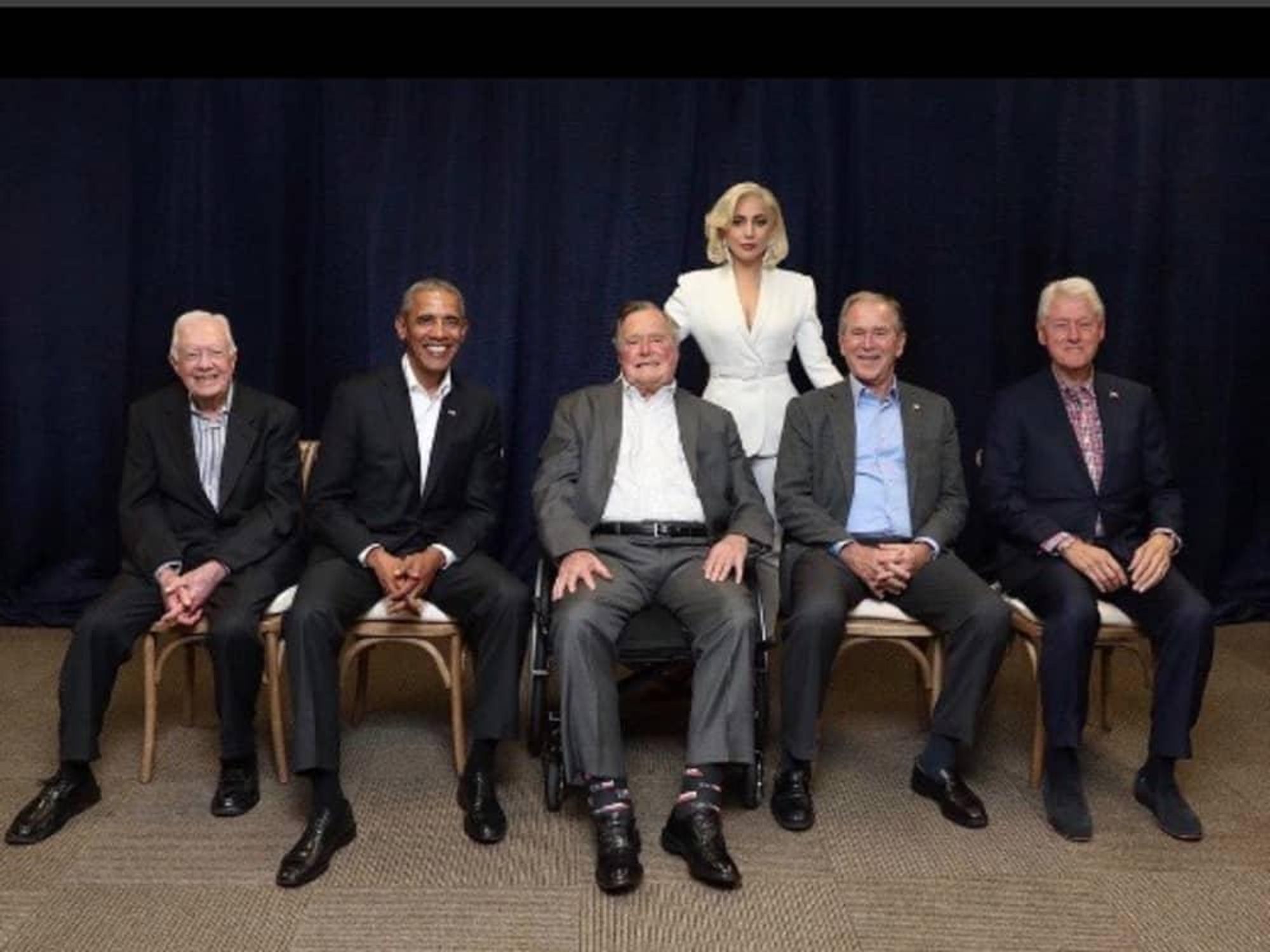 Lady Gaga poses with former presidents Jimmy Carter, Barack Obama, George HW Bush, George W Bush, and BIll Clinton at hurricane relief fundraiser