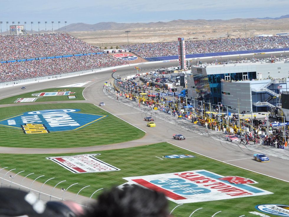 Las Vegas Motor Speedway in Nevada stadium crowd and race cars