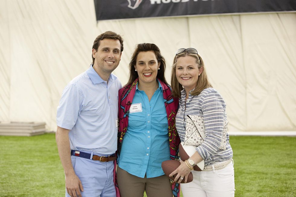 Laura and William Wheless IV, from left, with Dawn Swanson at The Society for Leading Medicine Houston Texans Family Field Day May 2014.