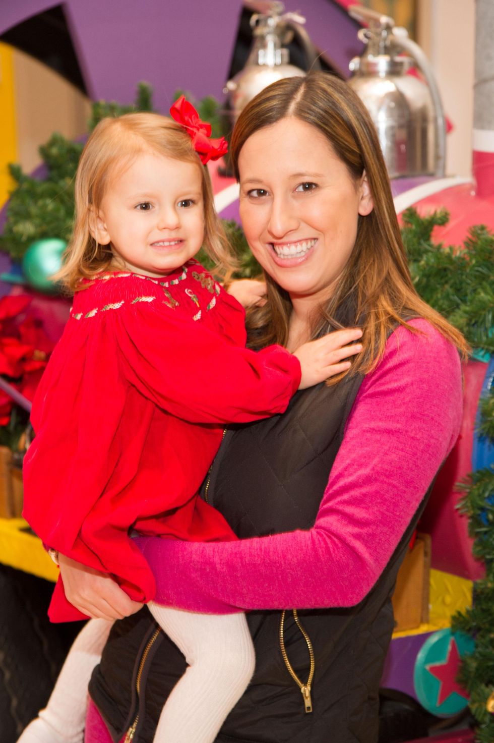 Laurie Lister and child at Childen's Museum Grinch party
