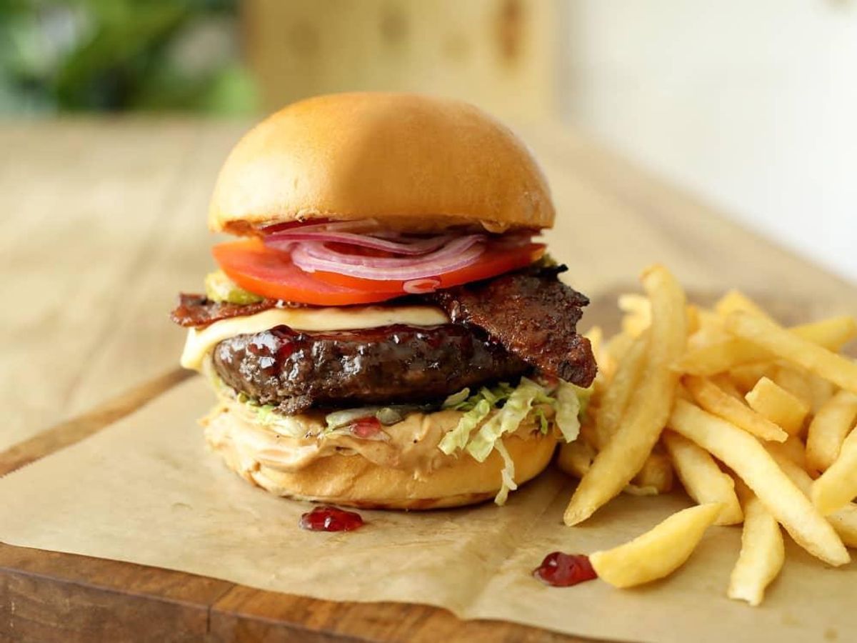 PB&J burger with candied bacon. - CultureMap Houston