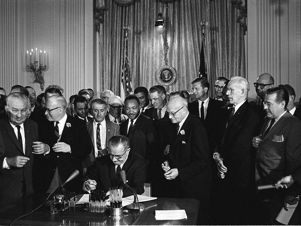 LBJ signing the Civil Rights Act on July 2, 1964