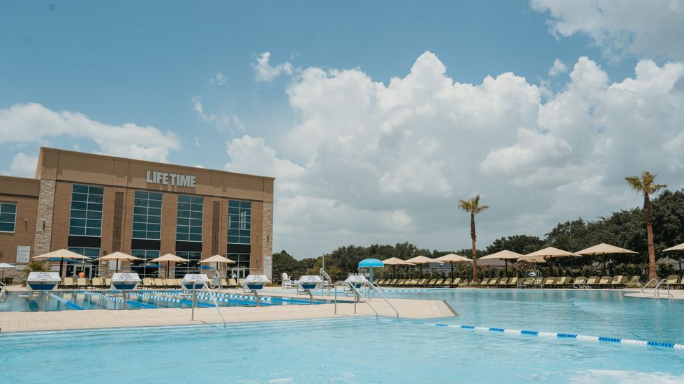 Life Time Sienna in Missouri City exterior with outdoor pools in the foreground